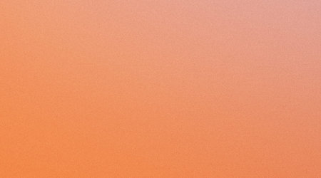 the image shows a close-up view of a textured orange surface that appears to have a grainy or...