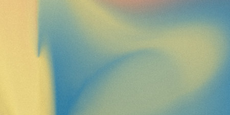 This image showcases a smooth gradient of soft pastel colors transitioning from a warm yellow to a cool blue. The texture appears delicate and watery, with a faint, almost transparent overlay that gives it a dreamy and ethereal quality. The seamless blending of colors creates a calming and serene visual effect, reminiscent of a tranquil sky or a gentle underwater scene. The subtle gradients and lack of distinct shapes contribute to its abstract nature, inviting viewers to interpret it in various ways.の写真素材