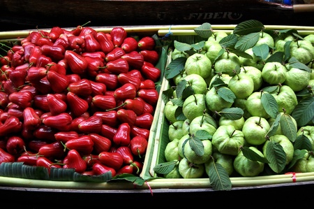 The morning sun shine on the juicy fruits, trying to catch attention from whoever visiting Bangkok Floating Market on May 2008の写真素材