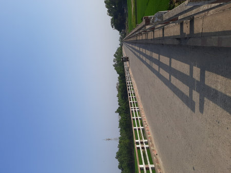 The road to the top of the dam with blue sky background.の写真素材