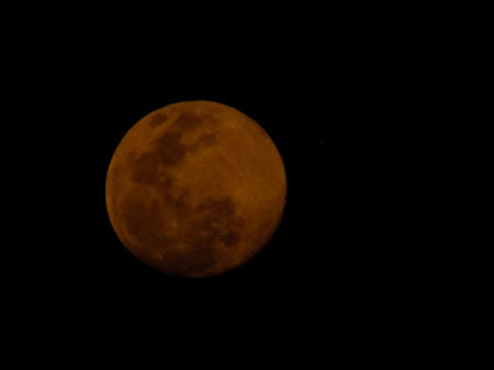 Gibbous moon with dark backgroundの写真素材