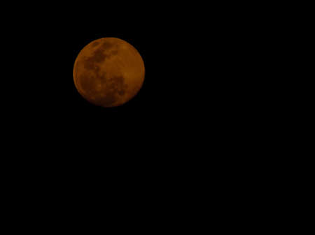 Gibbous moon with dark backgroundの写真素材