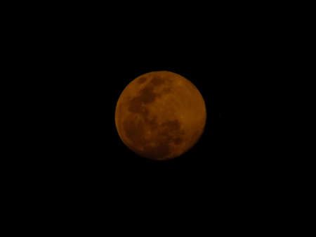 Gibbous moon with dark backgroundの写真素材