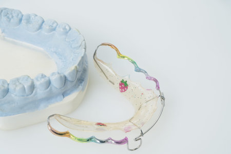 Dental  retainer orthodontic appliance on the white background.