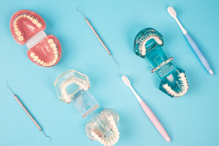 dentist tools and orthodontic on the  blue background, flat lay, top view.の写真素材