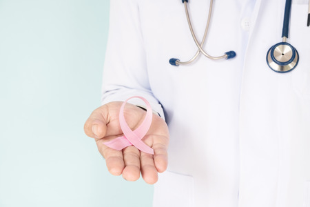 doctor with pink ribbon concept breast cancer and stethoscope.の写真素材