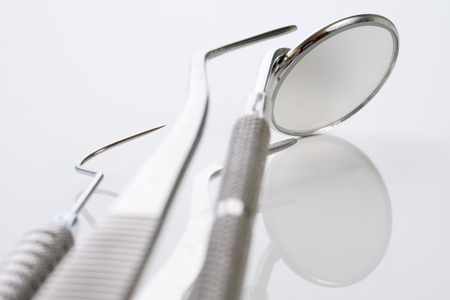 Close up / dental tools use for dentist on the white background.の写真素材