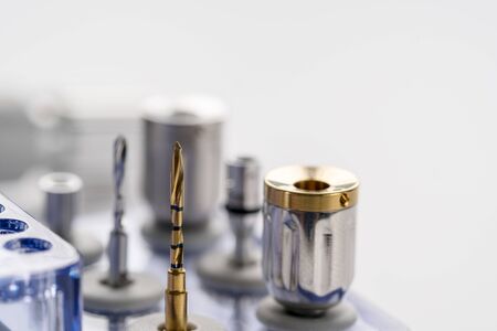 Closeup/ Implant surgical kits/ mini screw/ screw driver/ drilling bits on white background.の写真素材