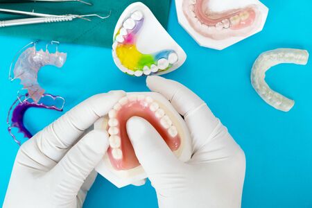 Complete denture or full denture on blue background.の写真素材