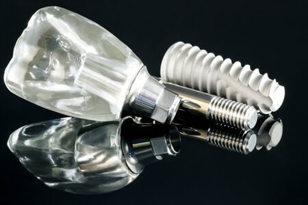 Close up dental implant  model on black background.の写真素材