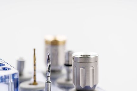 Closeup/ Implant surgical kits/ mini screw/ screw driver/ drilling bits on white background.の写真素材