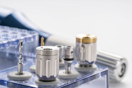 Closeup/ Implant surgical kits/ mini screw/ screw driver/ drilling bits on white background.の写真素材