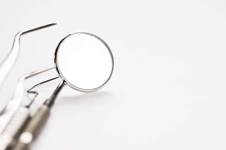 Basic dentist tools on white background.の写真素材
