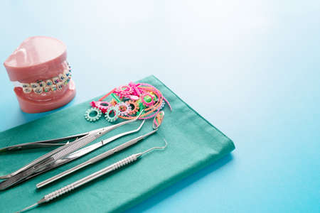 Dentistry medical tools forcept on blue background.の写真素材