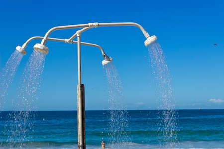 Outdoor shower on the beach with blue sky background and copy spaceの写真素材