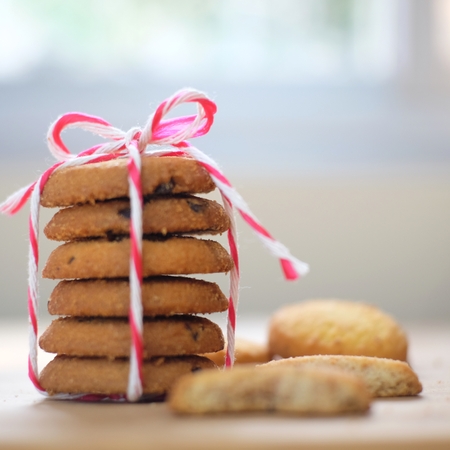 Stack of tasty choc chip cookies on wooden tableの写真素材