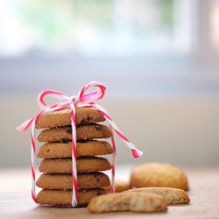 Stack of tasty choc chip cookies on wooden tableの写真素材