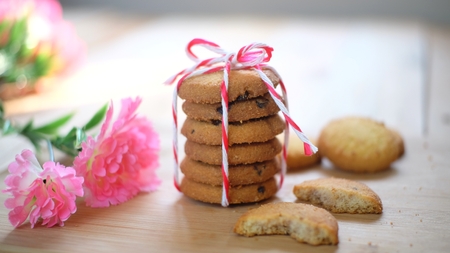 Stack of tasty choc chip cookies on wooden tableの写真素材