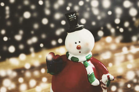 Christmas background with snowman and snow, vintage styleの写真素材