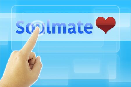 touching SOULMATE sign on blue screenの写真素材