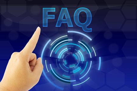 hand pointing "FAQ" word on blue digital backgroundの写真素材