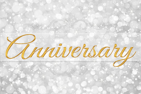 anniversary on white silver glitter bokeh abstract backgroundの写真素材
