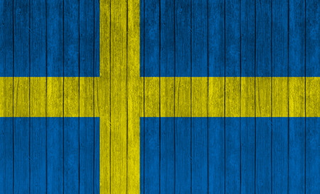 sweden, swedish flag on wood texture backgroundの写真素材