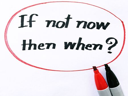 if not now then when? on white paperの写真素材