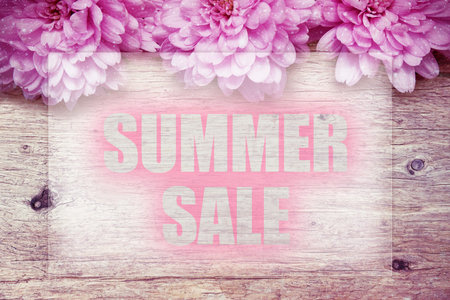 pink flowers on wooden with word Summer Sale