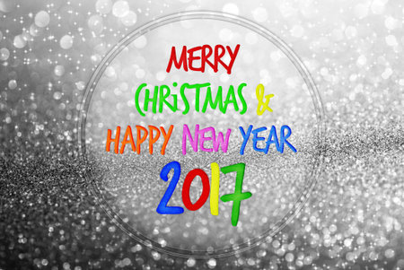 colorful word Merry Christmas and Happy new year 2017 on silver glitter bokeh background