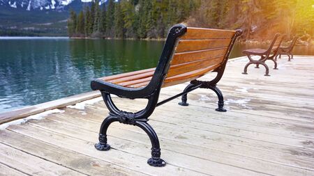 floating pier with bench by the lakeの写真素材