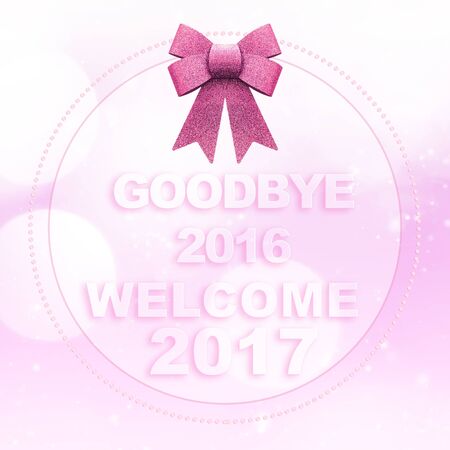 Goodbye 2016 welcome 2017 words on white pink bokeh background with glitter bowの写真素材