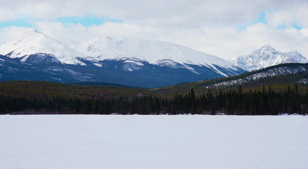 Frozen lake and mountain with snow covered, nature background in National Parkの写真素材