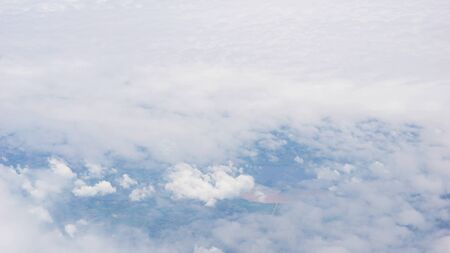 clouds over land, view from planeの写真素材