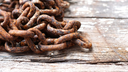 Rusty chains on wooden with copy space