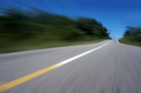 Highway road speed lines yellow and white texture background, radial motion blur / zooming effect.の写真素材