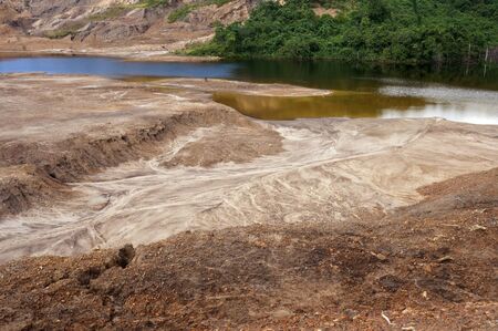 The Impact of coal mining on the environment. The mining location was abandoned without reclamation. Location: Sangatta, East Kalimantan/Indonesia.の写真素材