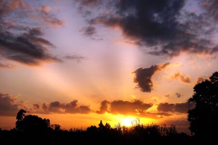 Beautiful sunset with dramatic rays of lightの写真素材