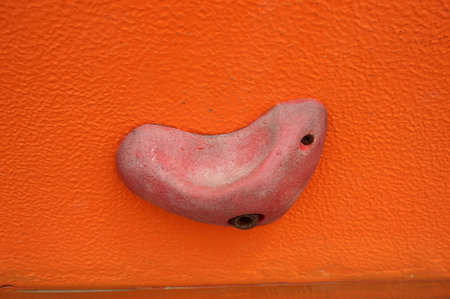 Stone hook on the artificial climbing wall at outdoor