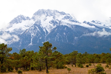 A distant view of Jade Dragon mountain in Lijiang, Chinaの写真素材