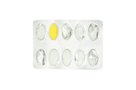 The last pill  in aluminium foil blister pack on white backgroundの写真素材