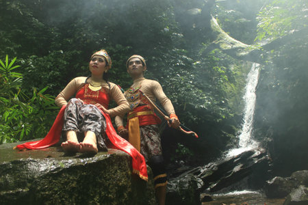 pre-wedding photos with the theme of Javanese ethnic traditional kebaya dresses in tropical forests.のeditorial素材