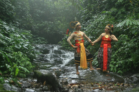pre-wedding photos with the theme of Javanese ethnic traditional kebaya dresses in tropical forests.のeditorial素材