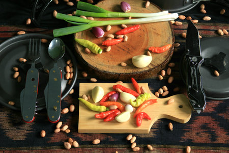 pans, knives, cooking utensils and kitchen ingredients such as chilies, shallots, garlic, peanut,...