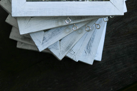 hand crafted photo frame with artistic dull white paint forming a beautiful pattern.