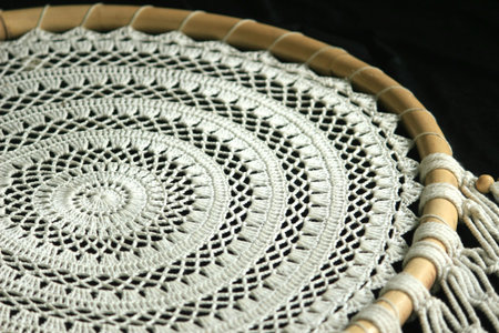 This art macrame craft made of crocheted rope for interior home decoration.