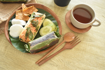 delicious grilled rice food menu wrapped in banana leaves. Baked rice is a traditional Indonesian food.の写真素材