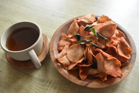 Cup of tea and snacks on a wooden table, stock photoの写真素材