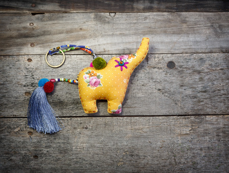 The elephant Craft of rag on the wood backgroundの写真素材