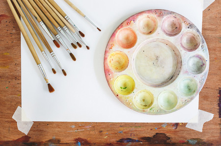 Palette and brush on the board backgroundの写真素材